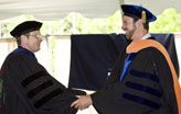 Ronald A. Chadderton, Ph.D., Chair of Civil and Environmental Engineering, congratulates Clay Emerson after the student’s Doctor of Philosophy hooding.