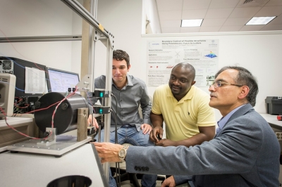 PhD candidate Dimitrios Karagiannis with postdoctoral fellow Cedrick Kwuimy, PhD, and C. Nataraj, PhD, professor of Mechanical Engineering and the Mr. and Mrs. Robert F. Moritz, Sr. Endowed Chair in Systems Engineering.