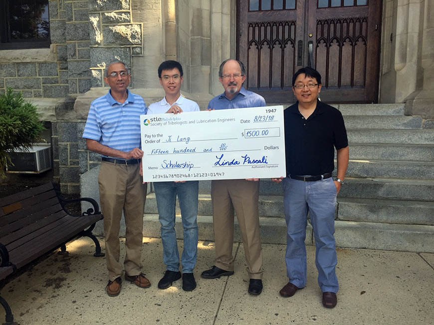 Mechanical Engineering Department Chair and Professor Dr. Sridhar Santhanam with scholarship recipient Ji Lang; Thomas O’Brien, representing STLE; and Associate Professor Dr. Qianhong Wu, who serves as Ji’s advisor. 