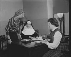 Two RN completion students with Sr. Alma Lawler, RSM, Co-Director, College of Nursing. February 25, 1954.