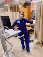 Female nurse wears a mask over her face at a New York hospital.