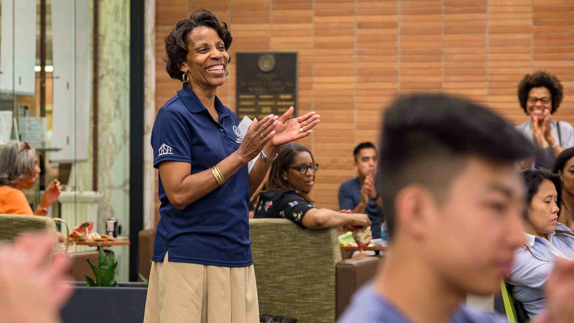 Linda Coleman clapping and laughing