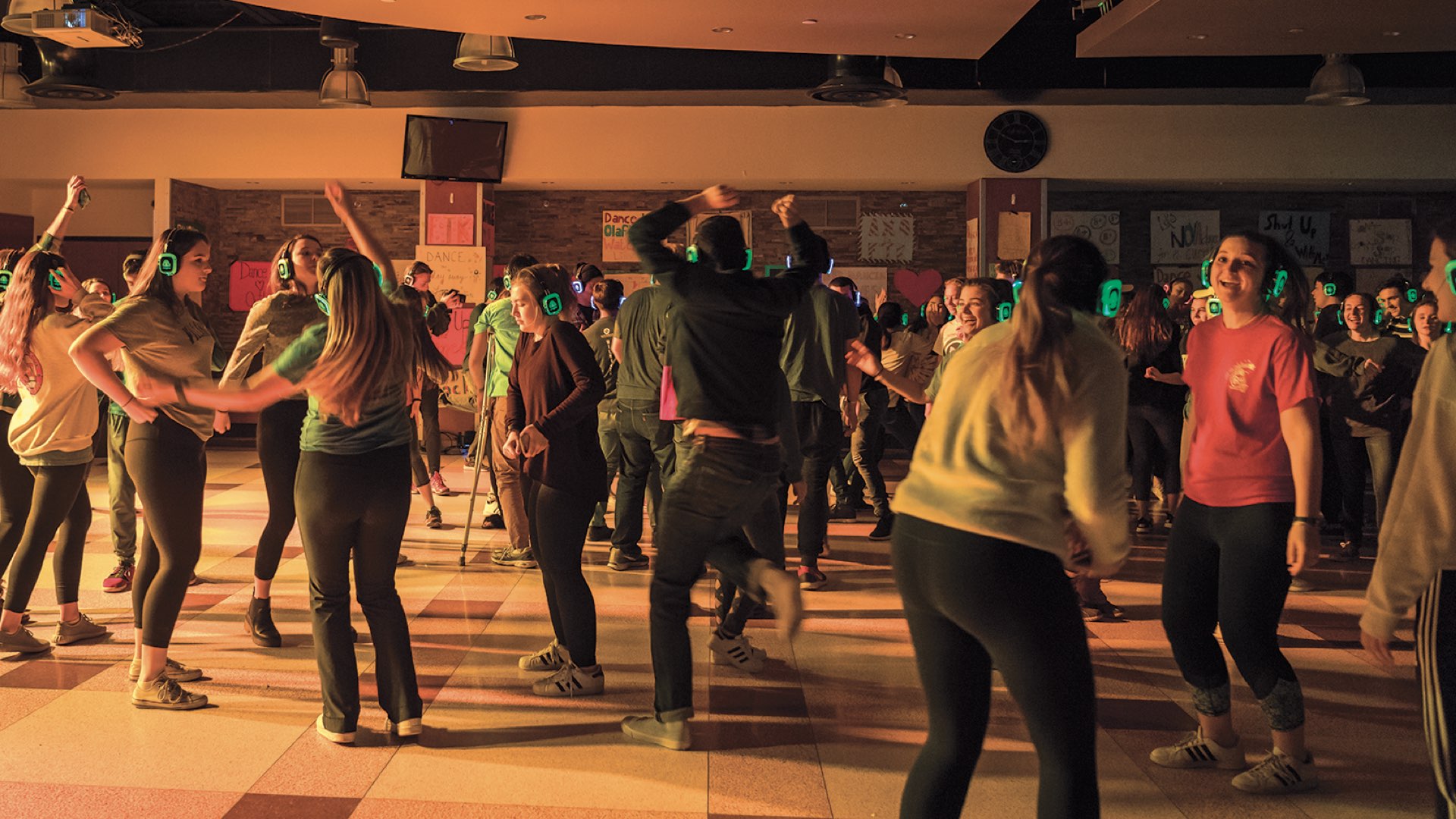 Villanova students dancing at a colorful silent disco.