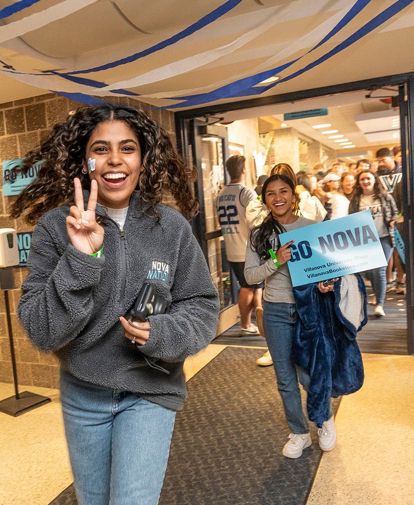 Students smiling and running with 