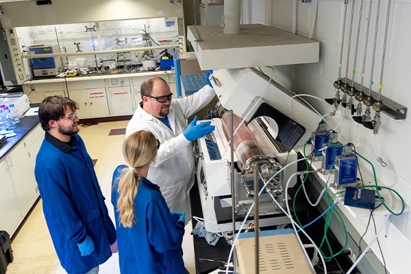 Instructor and students in a nursing lab