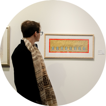 Man standing in front of an art piece