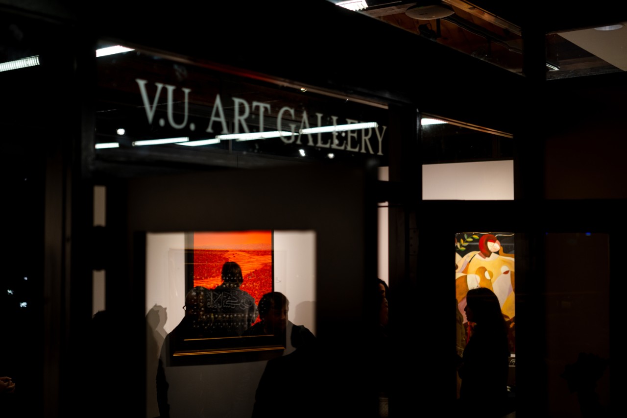 Silhouettes walking throughout the art gallery