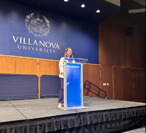 Jenna Fazio speaking at a lectern