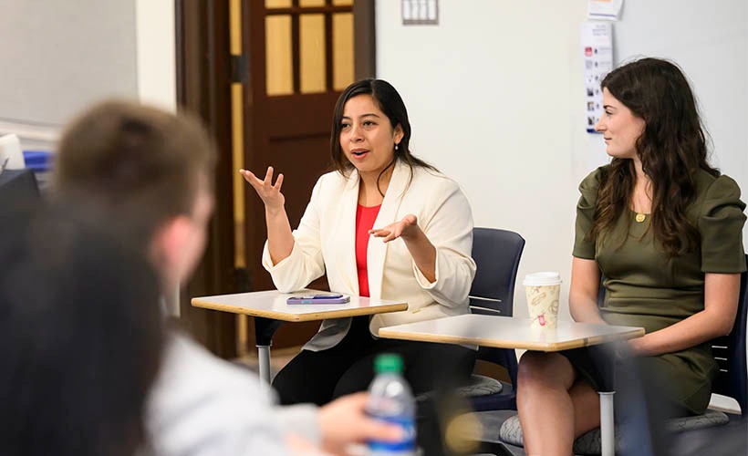 Villanova Engineering PhD Mentorship Program Students dressed professionally and talking in a classroom