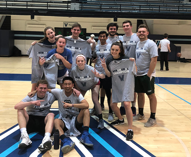 Students posing for basketball champion photo
