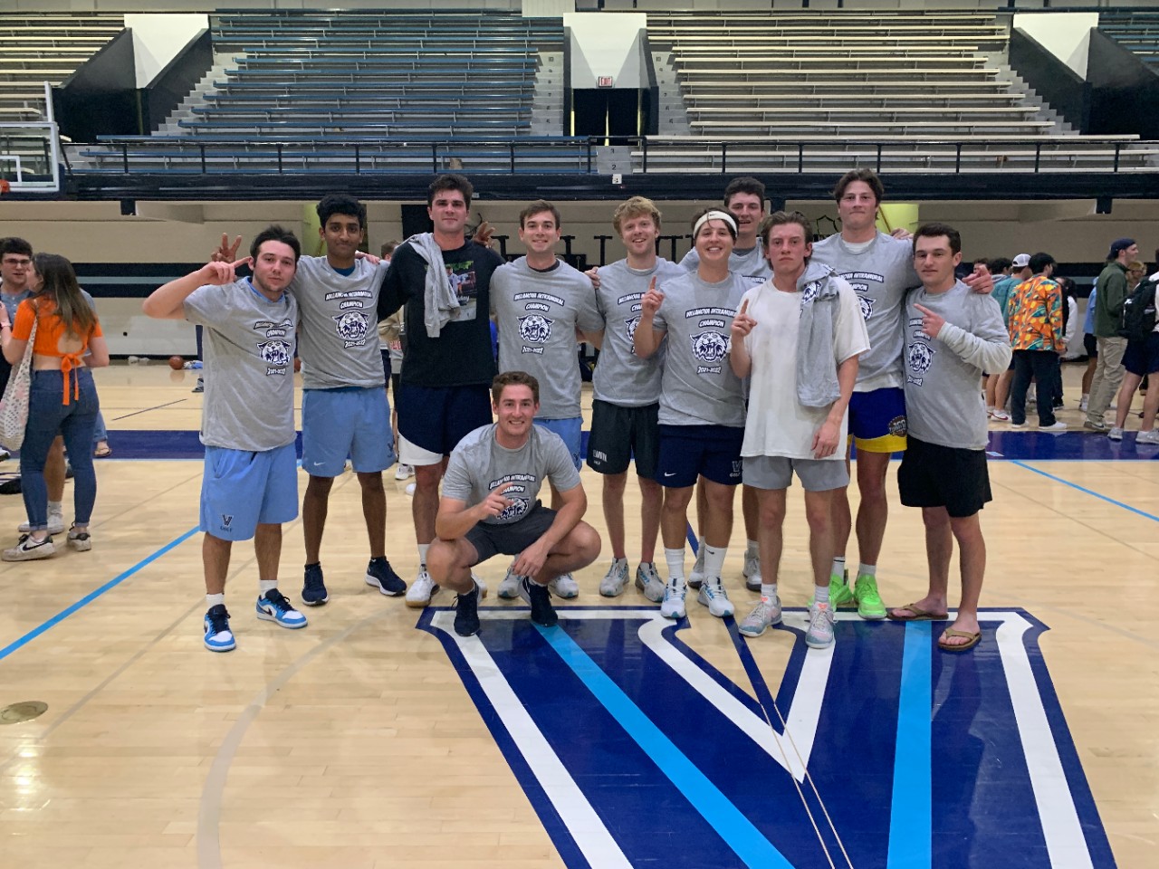 Male students posing for basketball champion photo