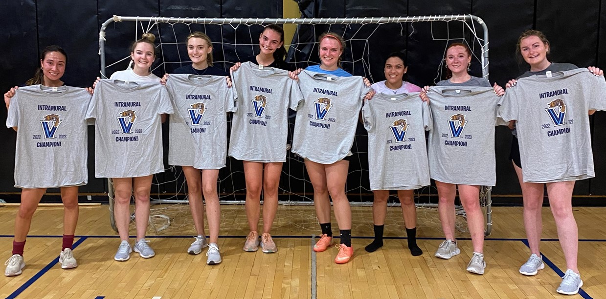 Women students posing for futsal champion photo