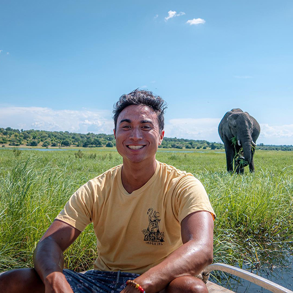 Nick Carney in Rwanda Nick Carney in a boat on a river in Rwanda