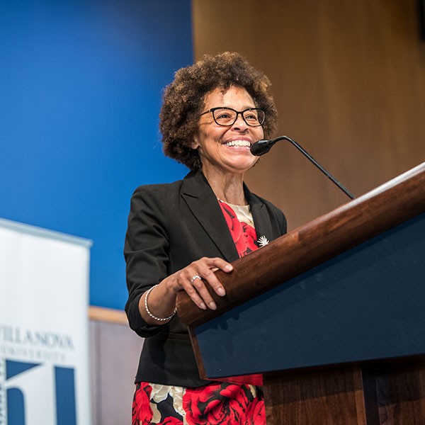Committed to Doing Better Dr. Teresa Nance speaks at a podium