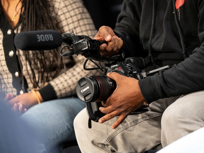 Person holding a camera