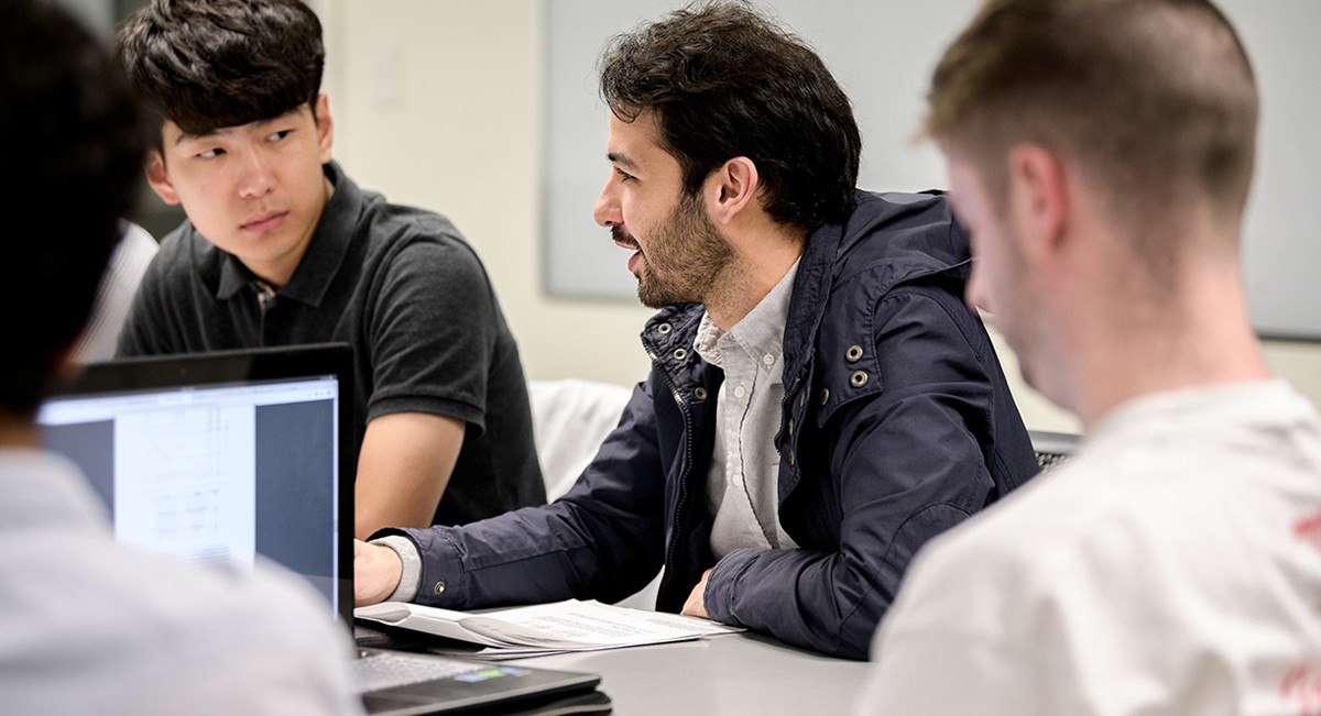 Graduate Computer Science students in class discussion