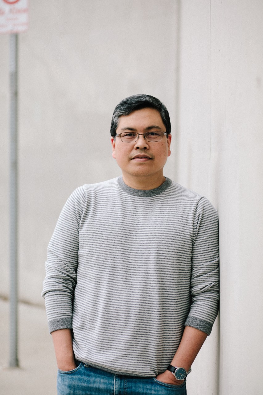 Rick Barot A man with glasses