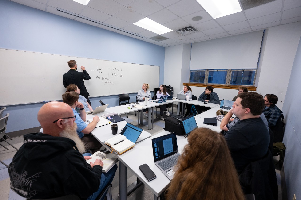 Students and a professor in a graduate History classroom at Villanova.