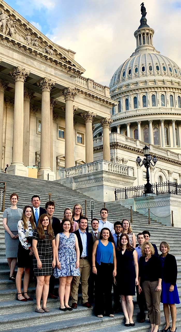 A group of Villanovans stand on the steps of the Capitol.