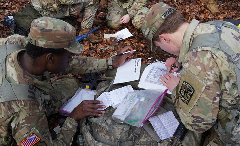 ROTC cadets work in the field. ROTC cadets work in the field.