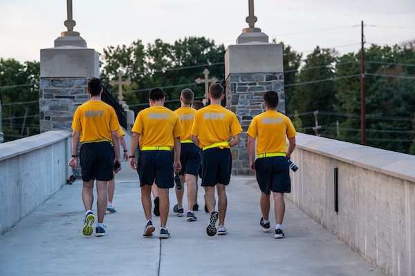 Management Roles Military students cross bridge