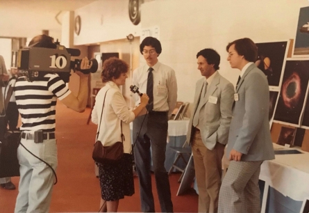 Dr. Maloney (left), Dr. Guinan (center) and researcher Craig Harris discuss their findings with a reporter during an unexpected TV interview at the 1982 American Astronomical Society Meeting. Dr. Maloney (left), Dr. Guinan (center) and researcher Craig Harris discuss their findings with a reporter during an unexpected TV interview at the 1982 American Astronomical Society Meeting.