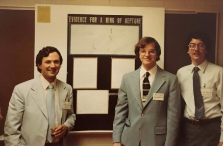 Astronomy student Craig Harris (center) proudly stands in front of his poster presentation at the 1982 American Astronomical Society Meeting, flanked by faculty researchers Dr. Edward Guinan (left) and Dr. Frank Maloney. Astronomy student Craig Harris proudly stands in front of his poster presentation at the 1982 American Astronomical Society Meeting, flanked by faculty researchers Dr. Edward Guinan and Dr. Frank Maloney