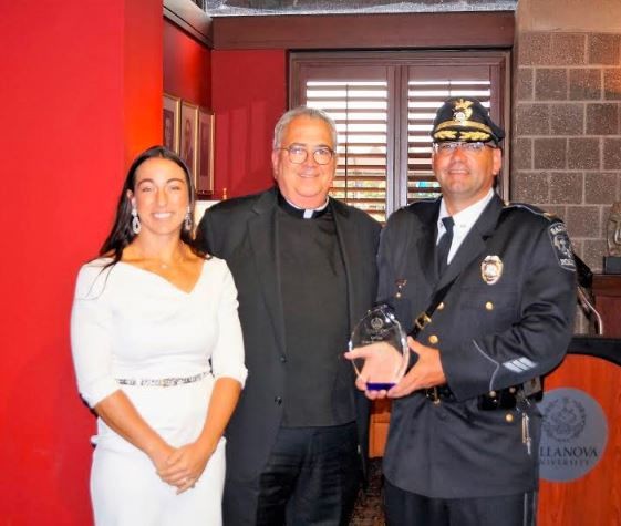 Caritas Award winner with University President Caritas Award winner with University President