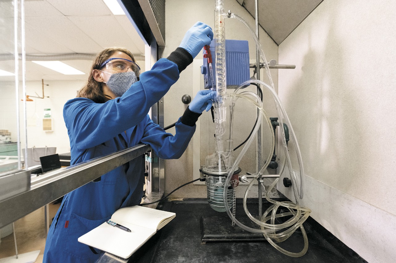 Boeing engineer Alicia Piscitelli dressed in personal protective equipment working in a lab