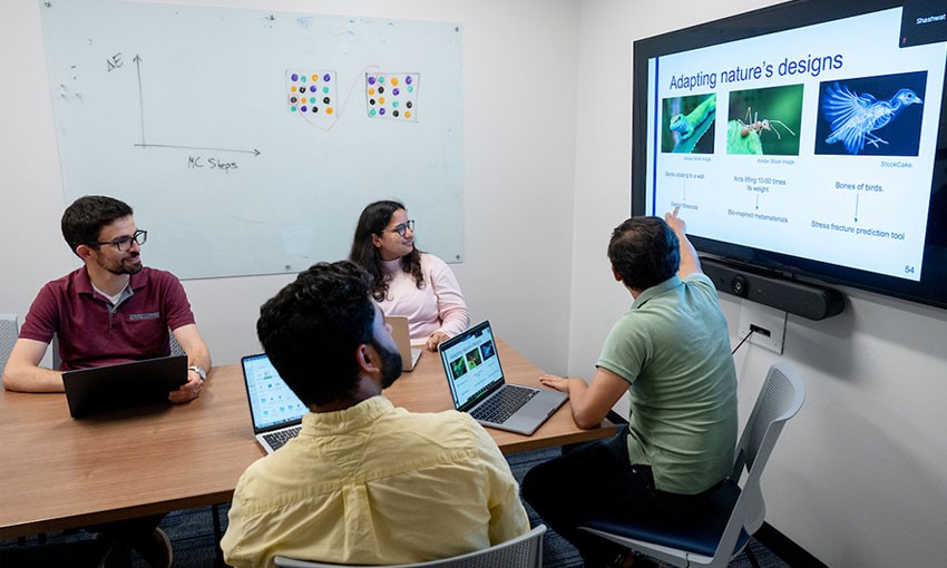 Professors and students viewing images on screen