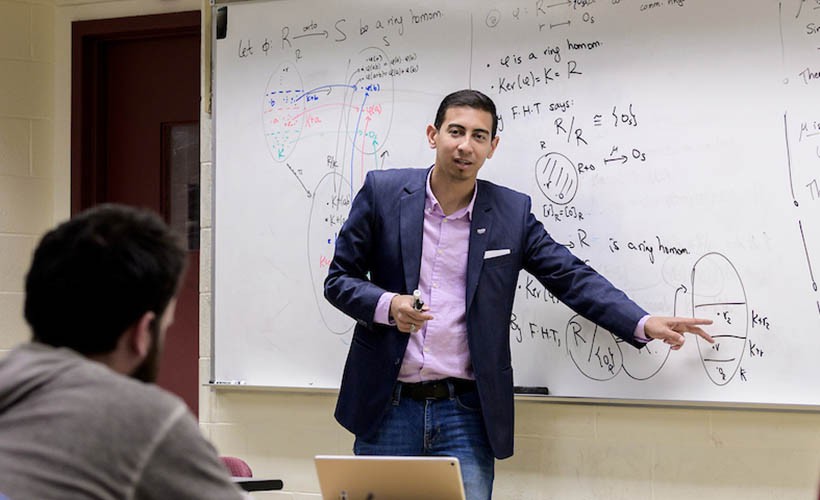 Faculty member teaching in classroom