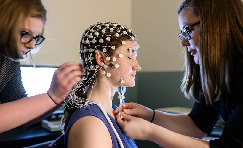 Researchers work with human subject.