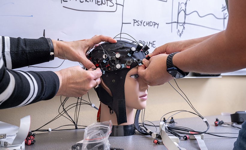 Researchers work with manikin head