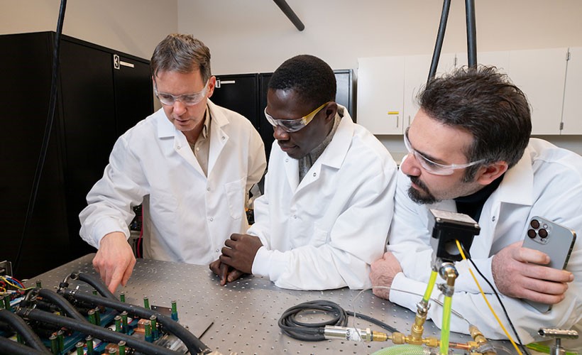 Professors standing in lab