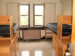 View of two beds and two desks in a Stanford Hall double room.
