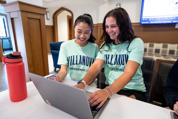 Resident Assistants Two resident assistants check in students during Move-In Day