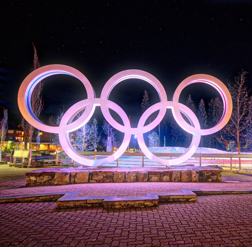Whistler Olympic Rings statute of Olympic Rings from Whistler lit up at night with purple lights