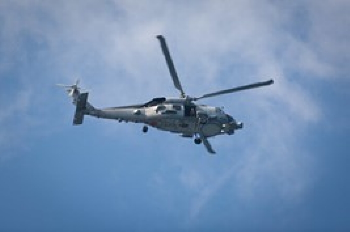 helicopter flying in blue sky