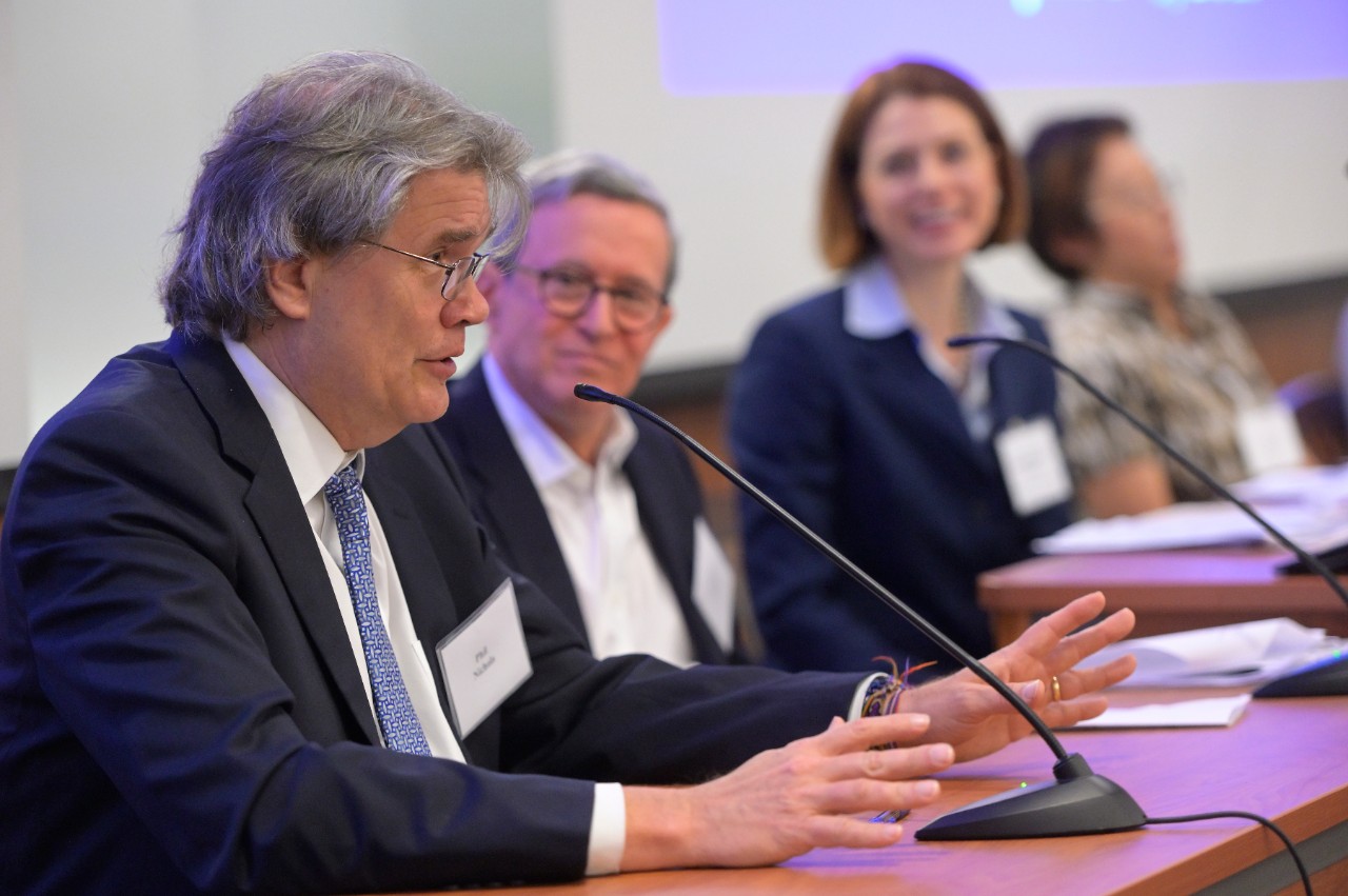 Phil Nichols and panel in background ComplianceNet Panel