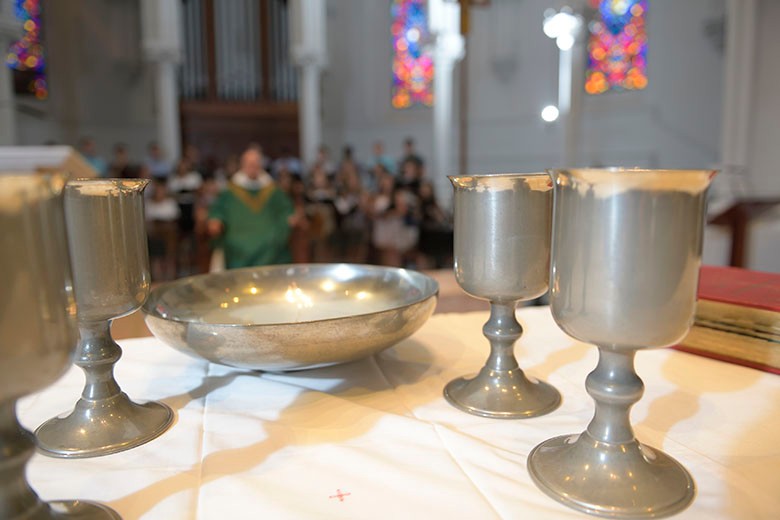 altar with chalices and paten holding bread to be consecrated