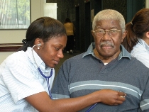 LaTrina Bailey checks the heart rate and rhythm of a University Square resident. LaTrina Bailey checks the heart rate and rhythm of a University Square resident.