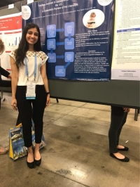 Anika Nana presents her group’s poster in the Exhibit Hall at the NSNA convention
