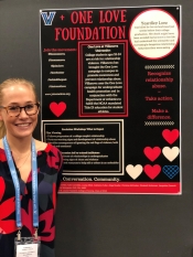 Kimmy Conlan presents her poster in the exhibit hall of the NSNA convention