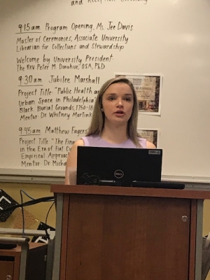 Erin Donnelly speaking at podium