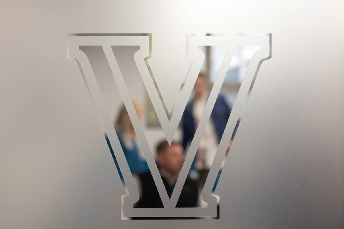 A frosted Villanova "V" door decor