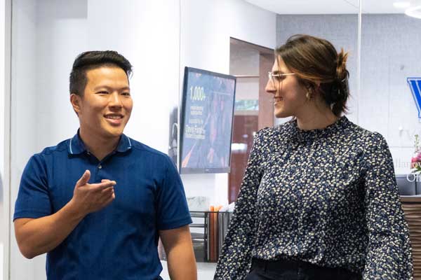 Two students speaking to each other in the Nydick Commons