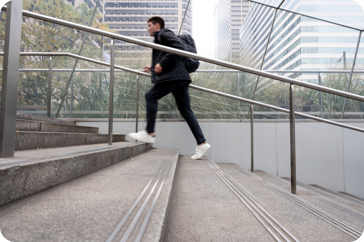 Student running up steps