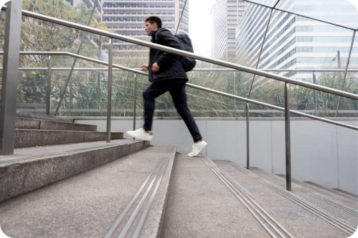 Student running up steps