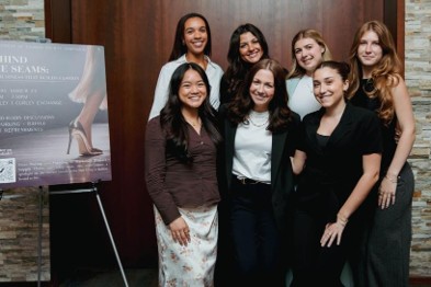 Eight women smiling