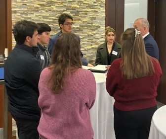 People standing at table